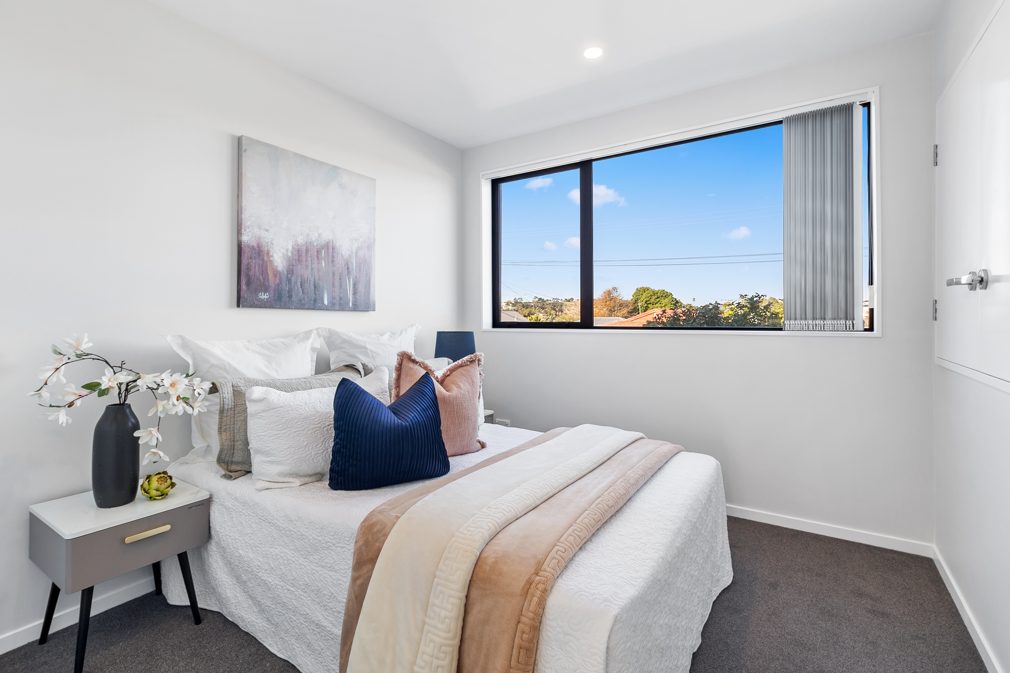 Light filled bedroom with elevated outlook and picture window Hobsonville Jev Matt.jpg